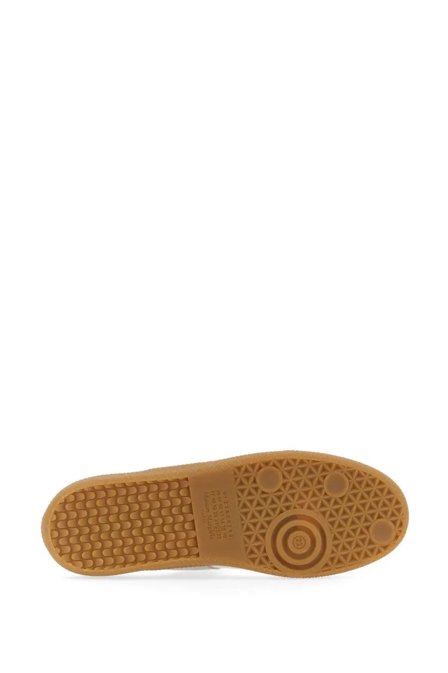 Tan rubber sole with geometric tread pattern and circular logo detail on maison margiela men’s replica sneaker white