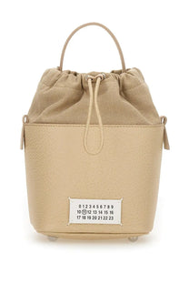 Maison Margiela unisex bucket bag beige with textured leather body canvas top and white label showing numbered sequences