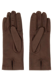 Maison Margiela women’s brown leather gloves with a smooth textured surface and subtle stitching on the back side