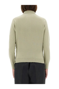 Maison Margiela women’s polo shirt in soft olive green knitted fabric with classic collar and ribbed cuffs