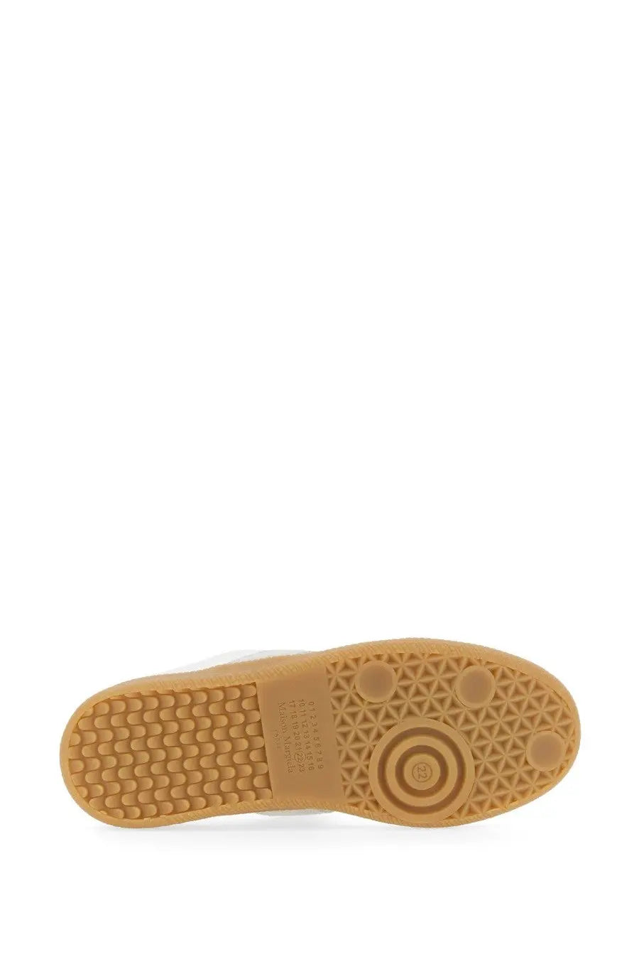 Tan rubber sole with geometric tread pattern and circular logo detail on maison margiela women’s replica sneaker white