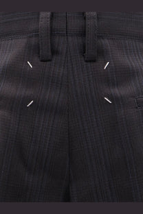 Maison Margiela women’s black pinstripe virgin wool trousers with distinctive white stitching accents