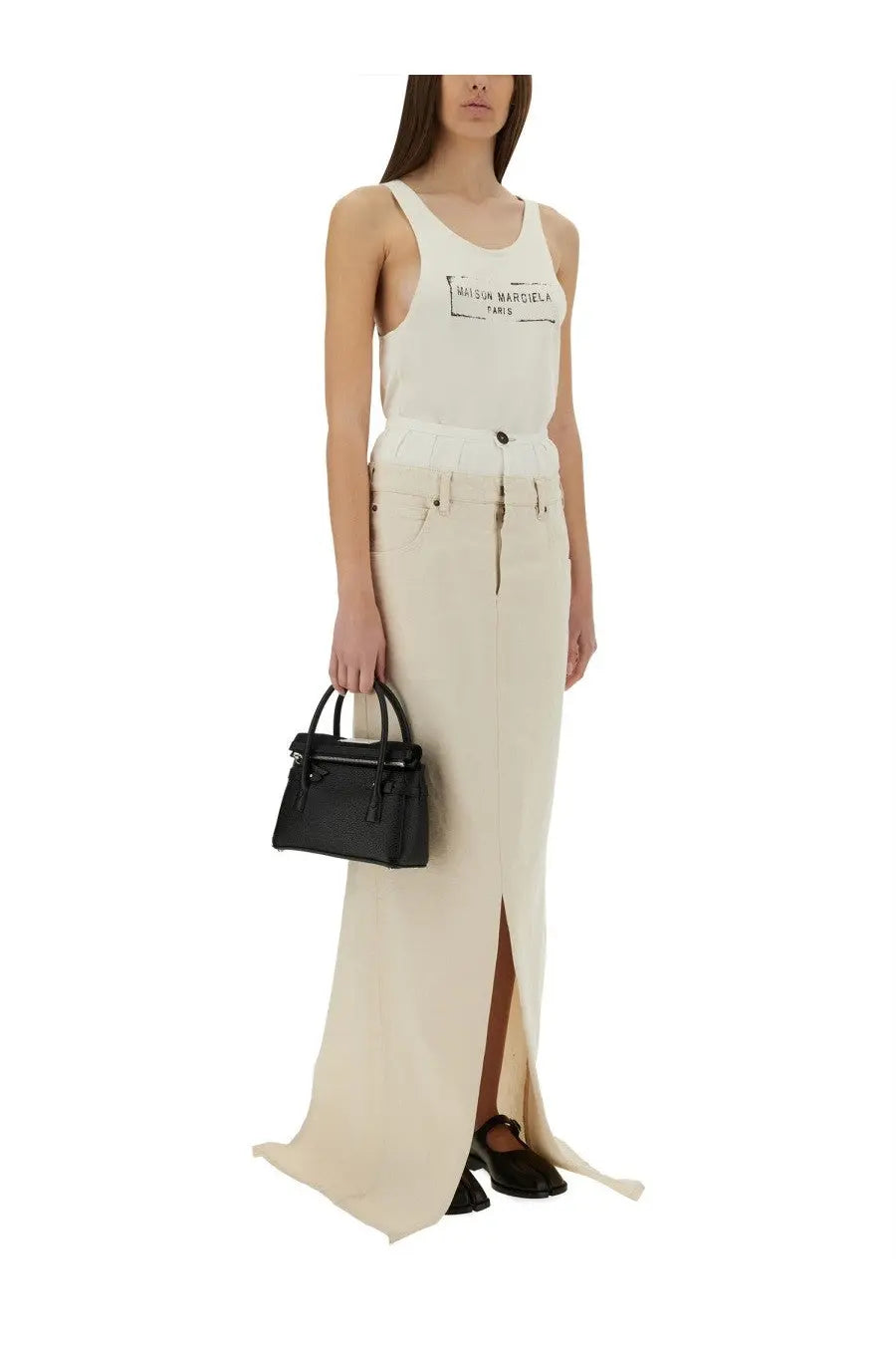 Black structured leather handbag with top handle and front flap closure for maison margiela women’s tank top beige