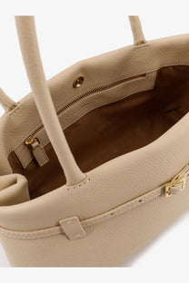 Beige textured leather tote bag with gold-tone hardware and top handles from manu atelier east west collection