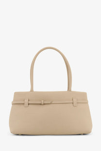 Beige leather manu atelier east west le cambon handbag with curved top handles and belt-style closure white