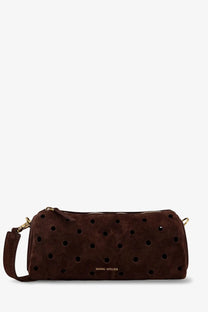 Manu Atelier women’s mini cylinder suede crossbody bag in brown with black circular perforations and gold-tone hardware