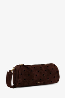 Manu Atelier women’s mini cylinder suede crossbody bag in brown with black perforated dots and gold-tone hardware