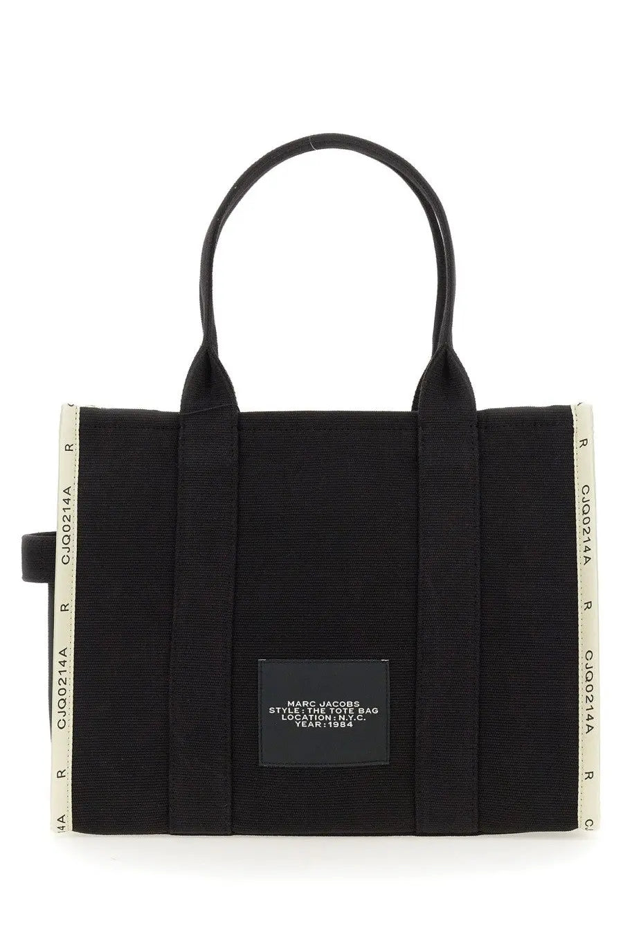 Black canvas marc jacobs tote bag with cream ribbed side panels and a black rectangular brand label in n.y.c