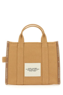Tan canvas marc jacobs women’s tote bag with reinforced handles and white label style the tote bag location n.y.c