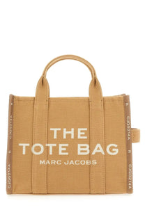 Marc Jacobs women’s borsa the tote medium beige tan canvas tote bag with white embroidered text and matching handles