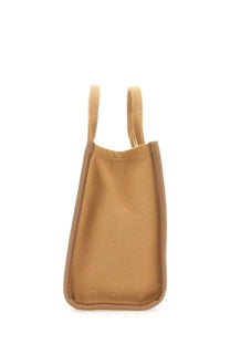 Tan woven tote bag with matching handles and reinforced edges from marc jacobs borsa the tote medium beige collection