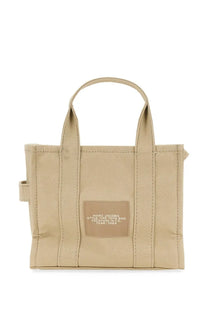 Beige canvas Marc Jacobs women’s borsa the tote small with matching patch label reading marc jacobs style the tote bag location nyc