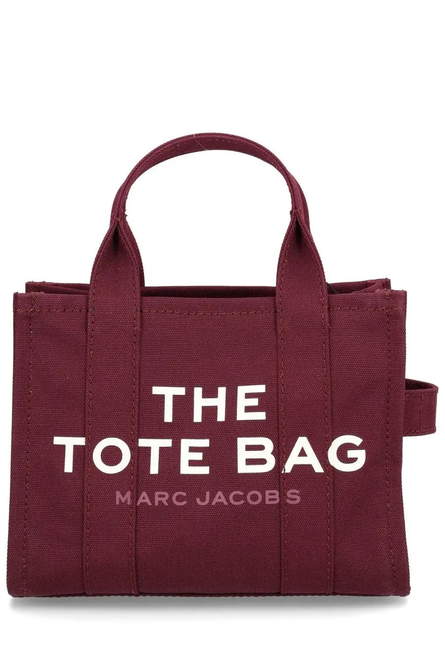 Maroon canvas tote bag with white the tote bag lettering and smaller pink marc jacobs text by marc jacobs