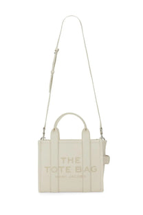 Cream-colored leather tote bag marc jacobs borsa the tote small white with embossed logo top handles and adjustable strap