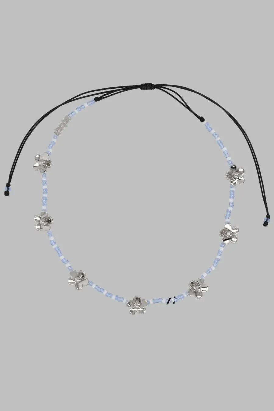 Marc Jacobs women’s collana daisy silver necklace with black cord, light blue beads, and silver flower charms