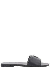Marc Jacobs women’s black leather slide sandal with minimalist design and small metallic logo on the strap