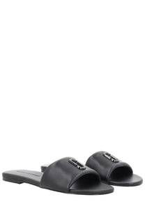 Marc Jacobs women’s black leather slide sandals with a minimalist design and metallic logo accent on the strap