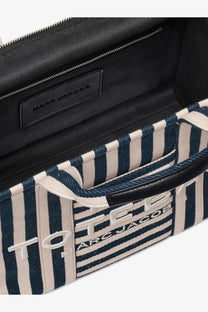 Marc Jacobs women’s navy and cream striped canvas tote bag with black leather accents and embroidered logo