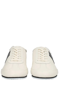 Cream-colored leather marine serre men’s astra sneaker with black accents and laces in white