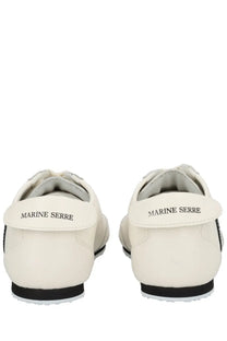 Back view of marine serre men’s astra sneaker in white leather with black accents and marine serre branding on the heel tab