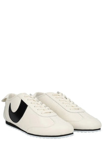 Marine serre men’s astra sneaker white with bold black nike swoosh, classic leather, and black rubber soles