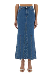 Marine serre women’s mid-blue denim maxi skirt with subtle crescent moon pattern along front slit and side panels