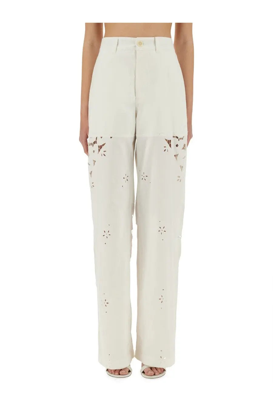 Cream-colored wide-leg upcycled linen pants with floral cut-out detailing on lower legs by marine serre
