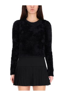 Marine serre women’s wild fluffy jersey black is a long-sleeved fuzzy sweater with a textured plush surface and round neckline