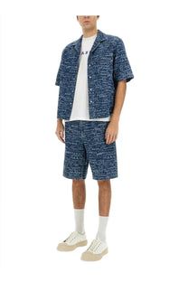 Marni men’s denim blue bowling shirt with short sleeves and repeating white m pattern button-up design