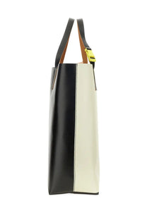 Black and cream two-tone leather Marni men’s Tribeca shopping tote bag with yellow buckle on handles
