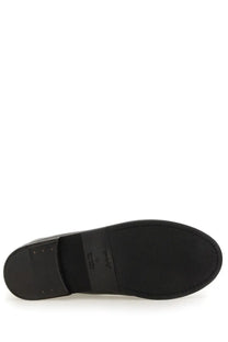 Black rubber sole with small rectangular label near heel of marsell men’s pumpkin wedge boot black back side view