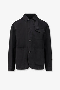 Black cotton button-up work jacket by Massimo Osti with collar and two large front pockets in Econyl regenerated nylon