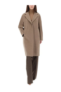Max Mara women’s Ardenne coat beige is a sleek camel-colored wool coat with a classic double-breasted design and notched lapels