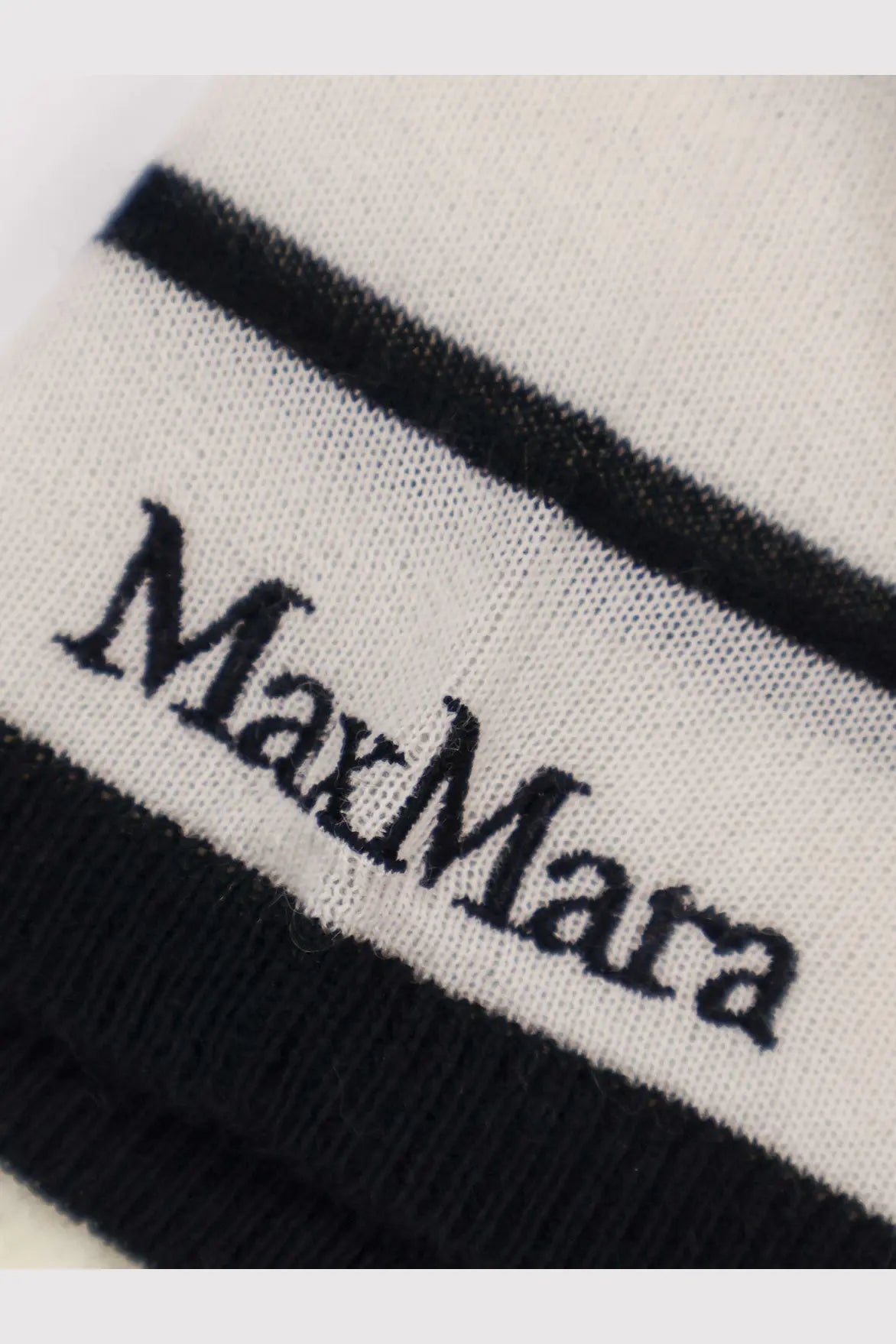 White knit sock with black ribbed cuffs and stripe featuring max mara logo paired with cashmere silk blend sweater