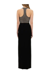Back view of max mara women’s century black evening gown with beaded open-back bodice and sleek flowing skirt