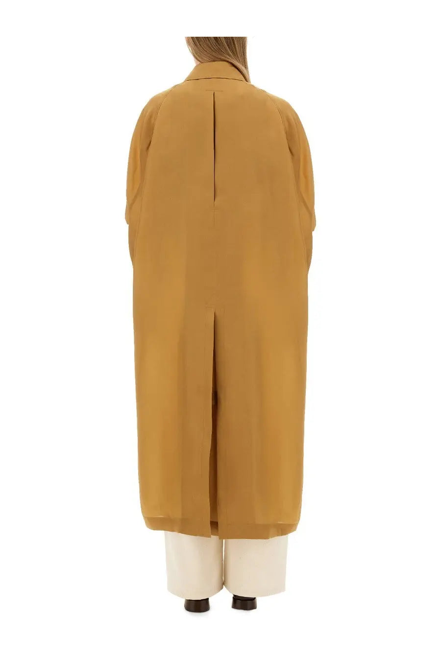 Back view of Max Mara women’s mustard yellow trench coat with central seam and wide sleeves in sack beige style