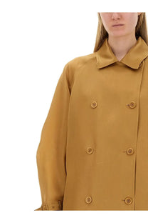 Max Mara women’s trench coat in mustard yellow with structured collar and matching buttons for stylish outerwear
