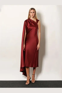 Max Mara women’s Edolo silk dress in red featuring a sleek satin finish with a draped cape sleeve and asymmetrical hemline