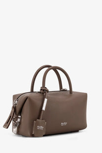 A sleek taupe leather Max Mara women’s holdalls handbag with structured design and matching leather handles in gold