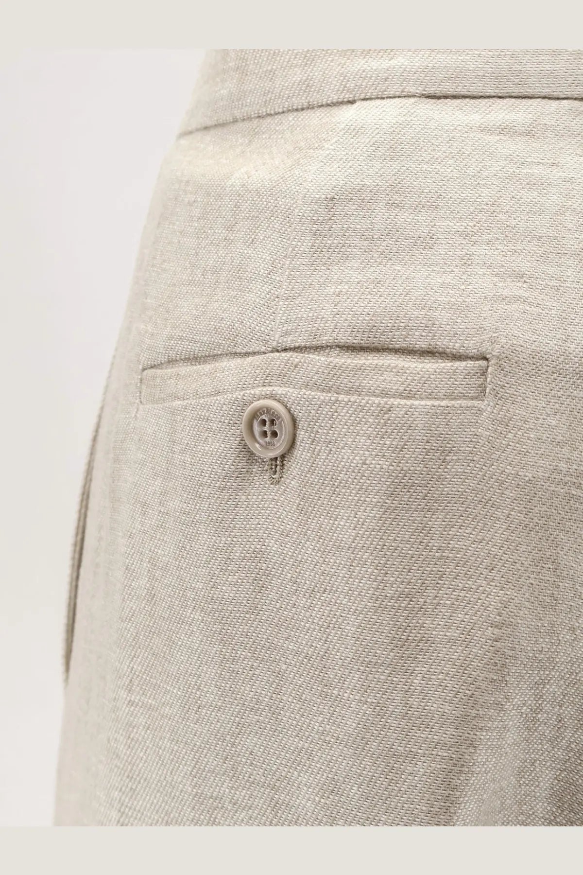 Beige linen ginnico trousers by max mara shown from the back featuring woven texture and button closure on back pocket