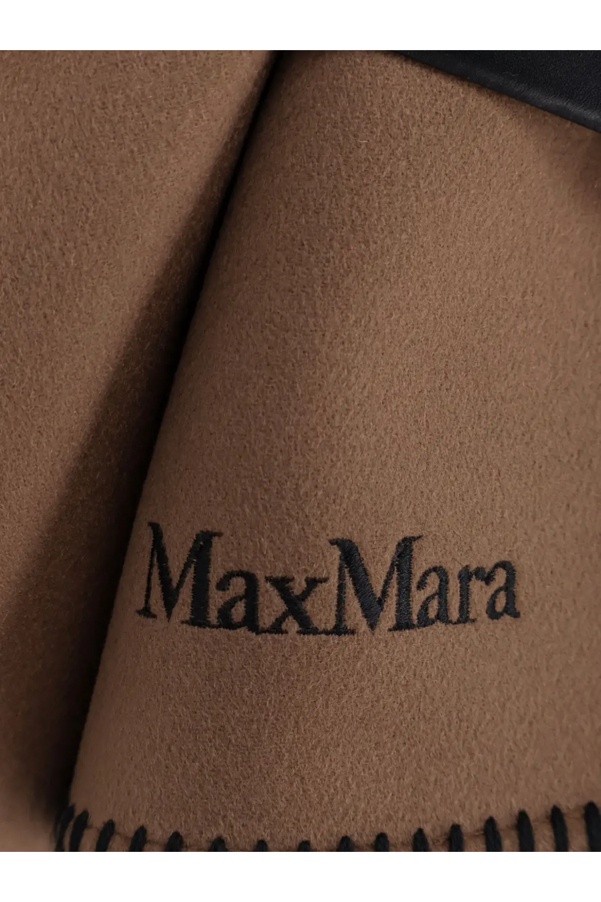 Brown suede fabric with black embroidered maxmara logo and stitched edge detail on max mara women’s virgin wool cape
