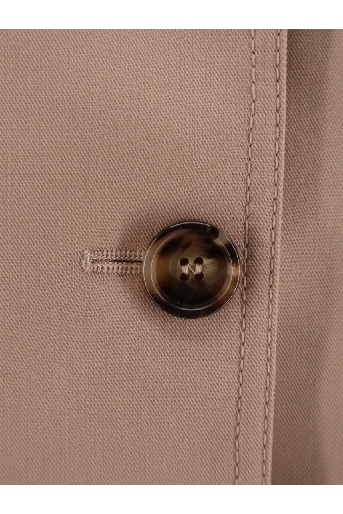 Max Mara tortoiseshell button with four holes on beige fabric detail