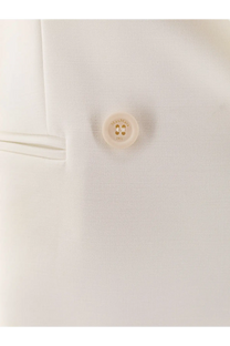 A cream-colored hermès button with 1951 engraving on the max mara white stretch virgin wool blazer