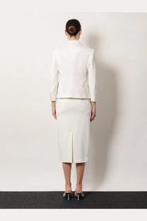 A sleek white tailored suit with a structured blazer and max mara stretch virgin wool pencil skirt