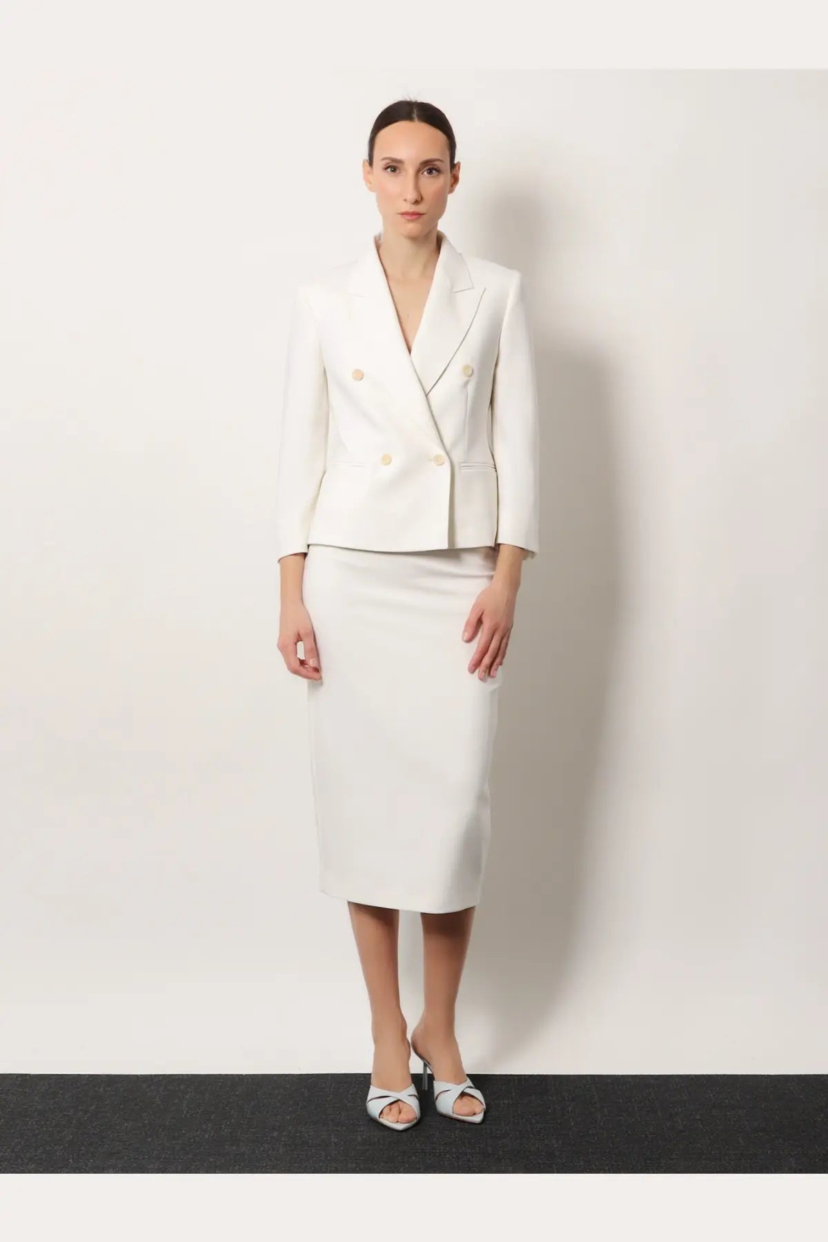 A sleek white double-breasted blazer with gold-toned buttons and tailored fit paired with max mara stretch virgin wool skirt white