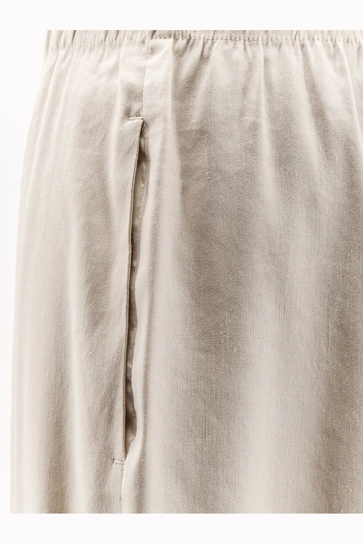 Beige linen and viscose relaxed fit trousers with subtle vertical seam detail from Max Mara women’s collection