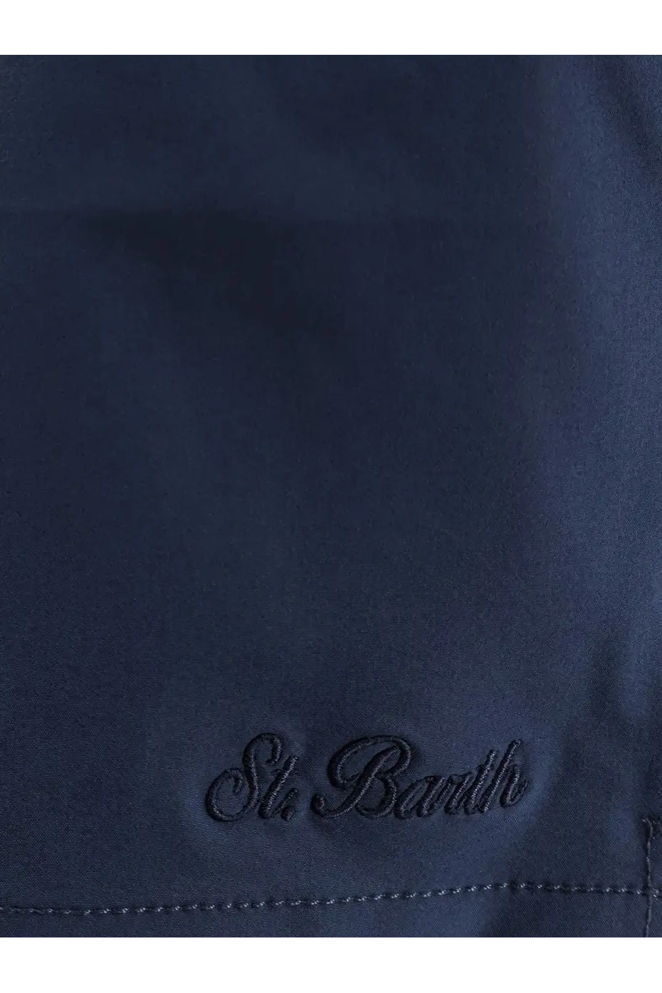 Dark navy mc2 saint barth men’s comfort swim trunks with subtle st pattern made from recycled nylon