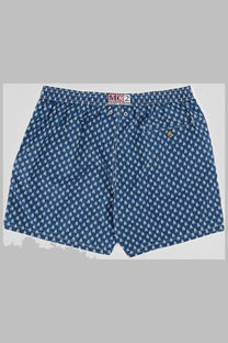Navy blue Mc2 Saint Barth men’s swim trunks with white sailboat print and elastic waistband with drawstrings