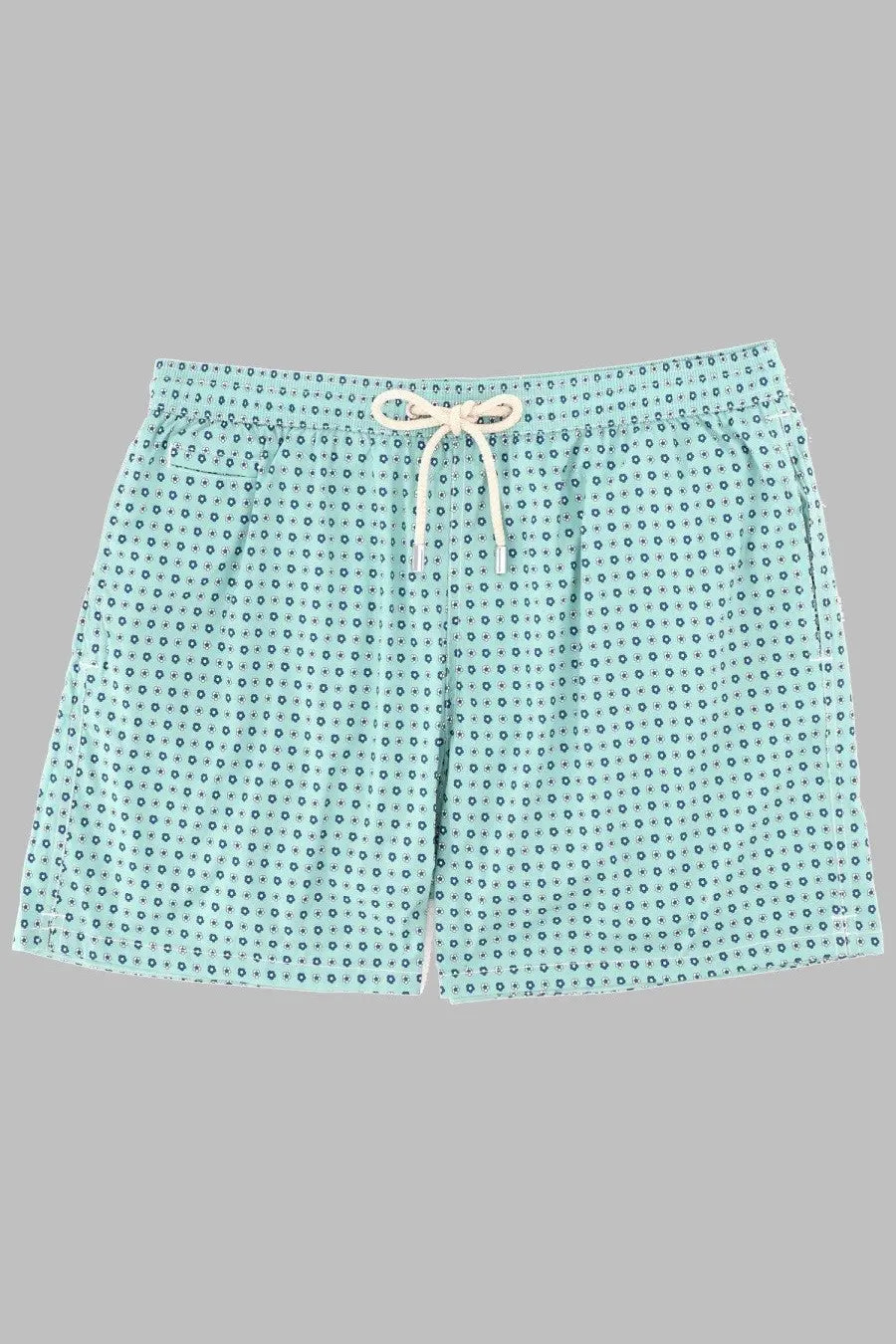 Light blue swim trunks with dark green dot pattern and cream drawstring by mc2 saint barth for men
