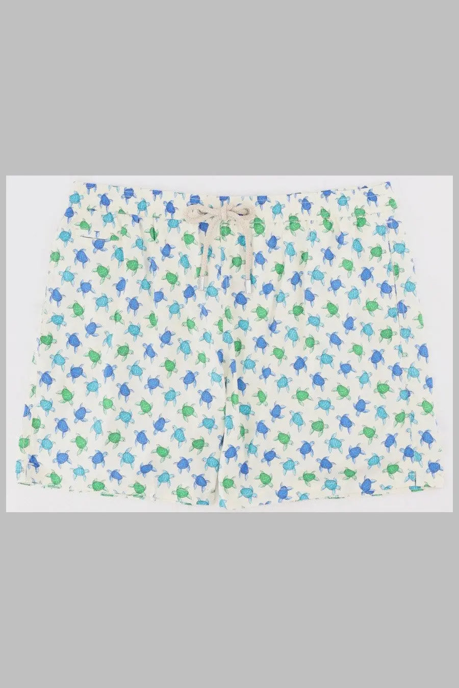White shorts by mc2 saint barth featuring a playful blue and green turtle pattern ideal for men’s swimwear